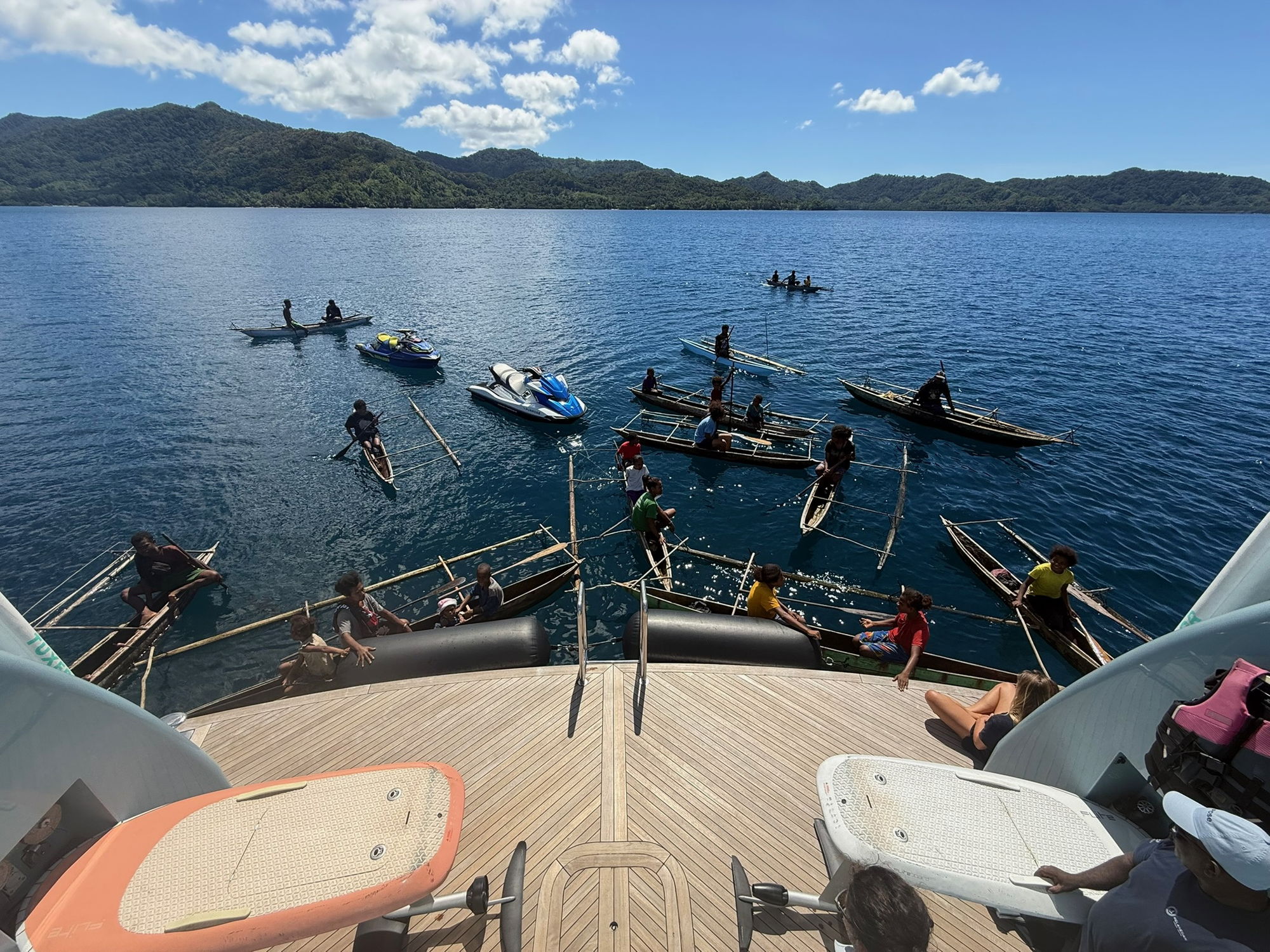 Outriggers and paddleboards off the swim platform.